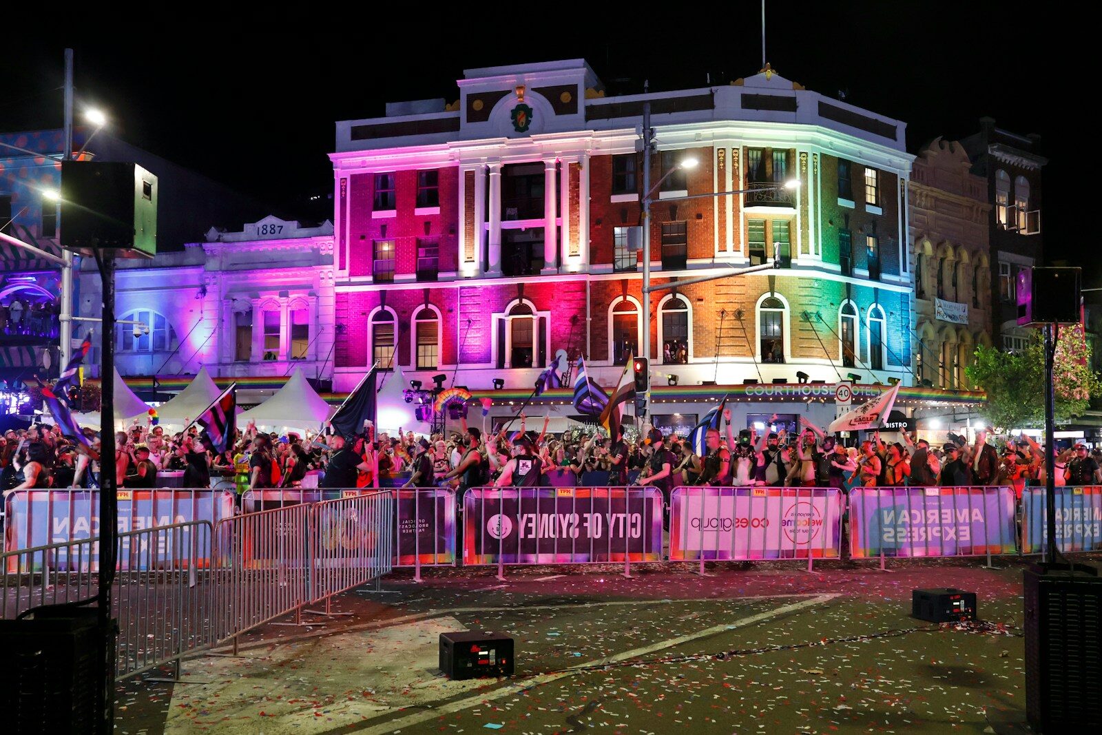 Building illuminated with rainbow lights during a night event