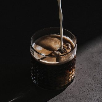 beverage pour on clear drinking glass